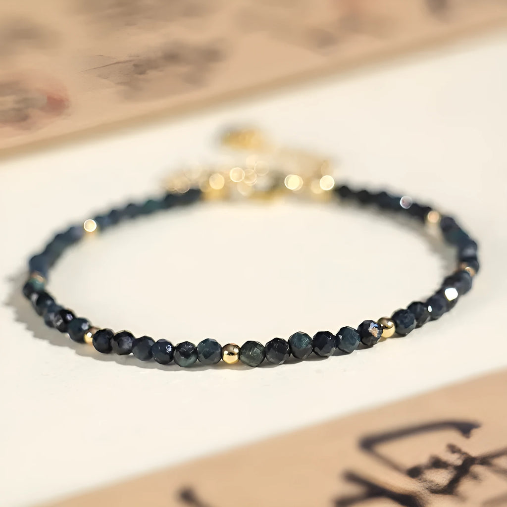 Women's blue tourmaline bracelet with 3mm beads and spacer design