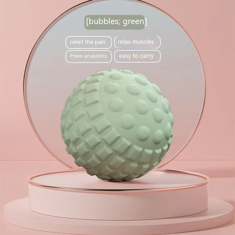 A 6cm diameter TPR foot massage ball shown in one of four colour options: pink, blue, green, or purple.