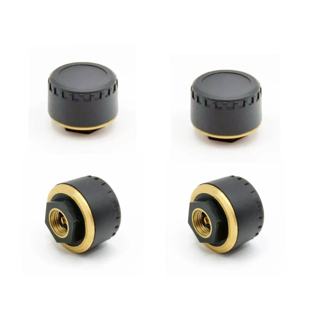Four black wireless Bluetooth tyre pressure sensors for car monitoring system with mobile phone display