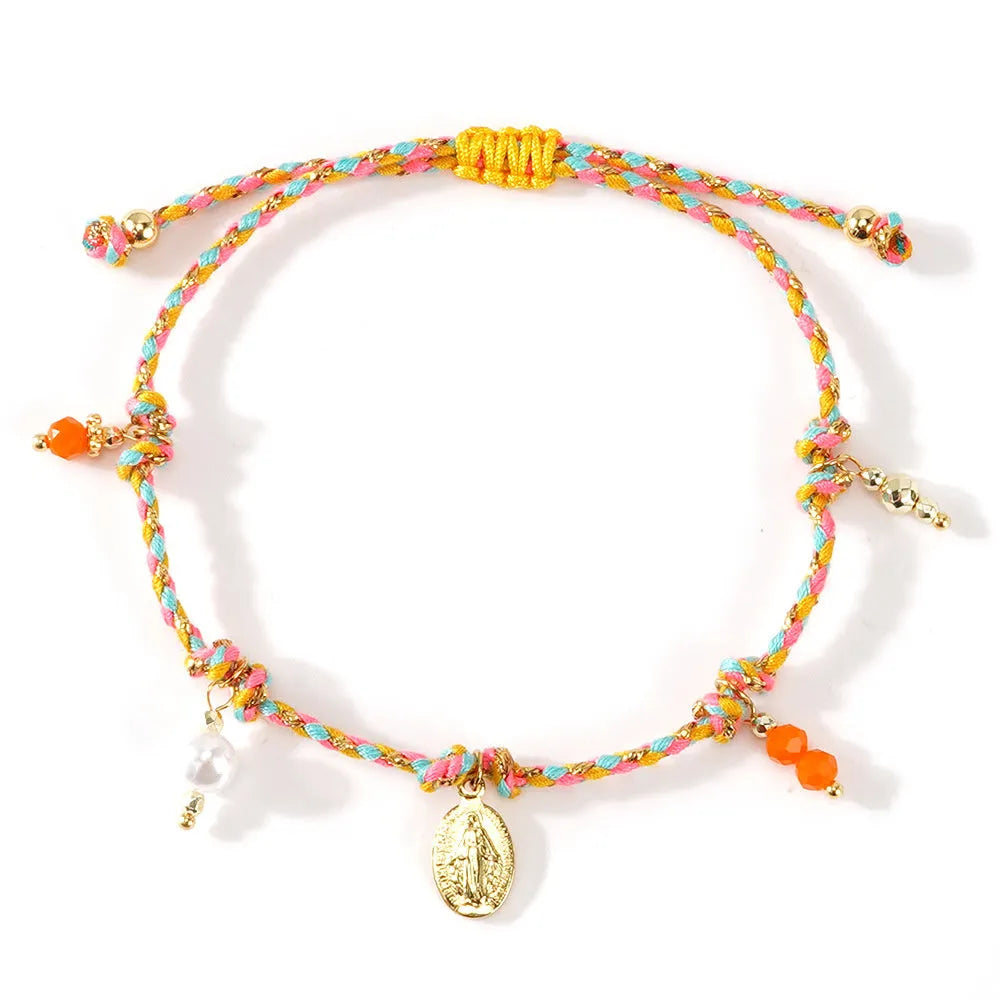 Close-up of a hand-woven colourful braided rope bracelet for women, showing textured ethnic style.