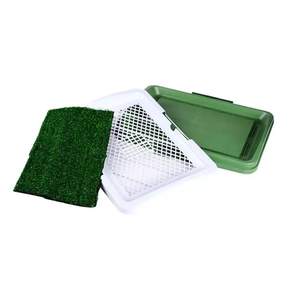 Green synthetic turf dog toilet tray with a plastic base for indoor puppy potty training.