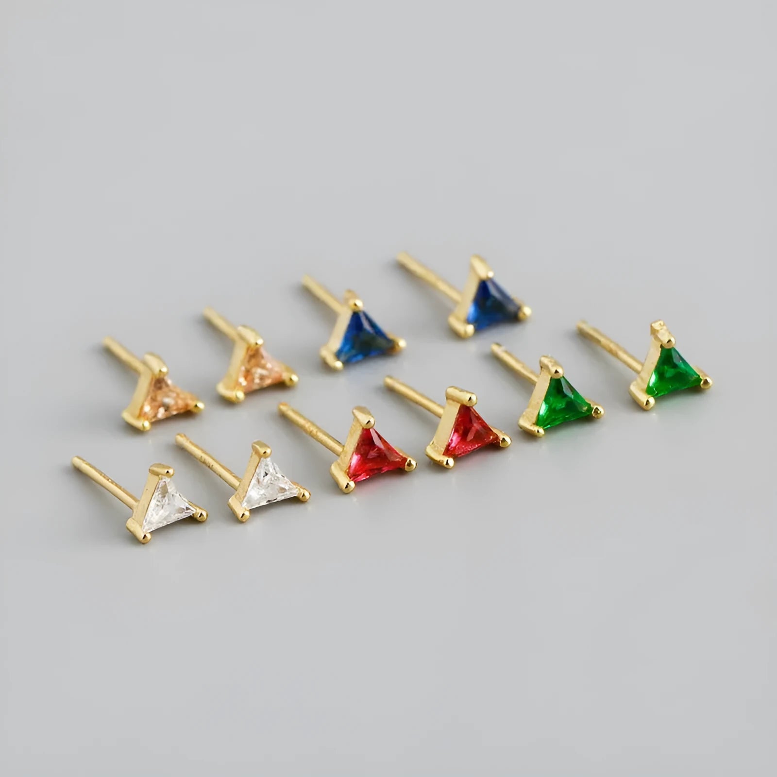 Pair of triangle colour zircon stud earrings in S925 silver on a white background