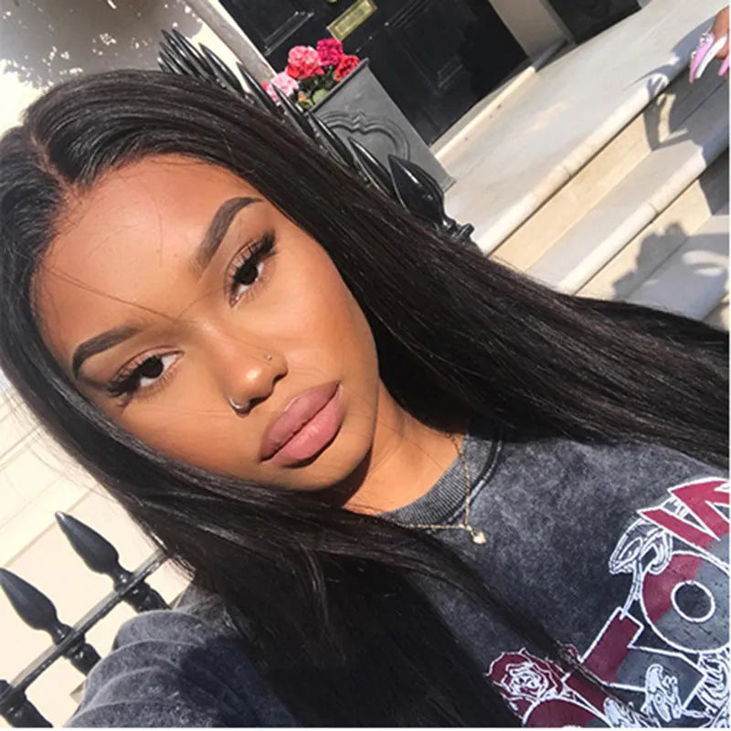 Long straight black synthetic wig with centre part and bangs on a model