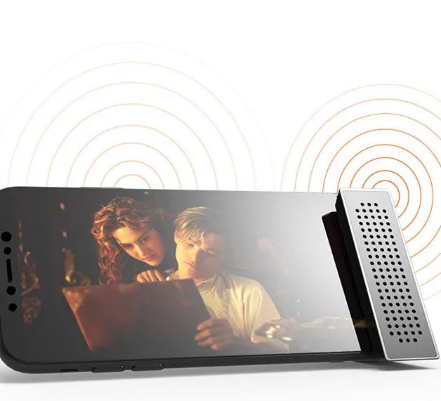 A portable black ABS plastic mobile phone amplifier bracket holding an iPhone.