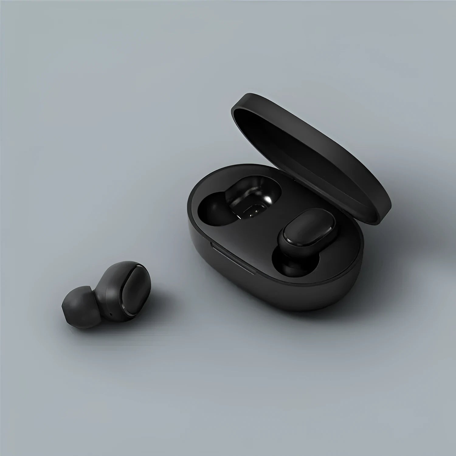 Redmi AirDots Black true wireless earbuds and charging case on a white background.