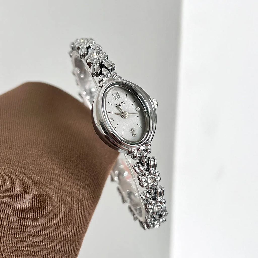 Women's light luxury retro compact alloy watch with 8mm thin case and white dial on white strap