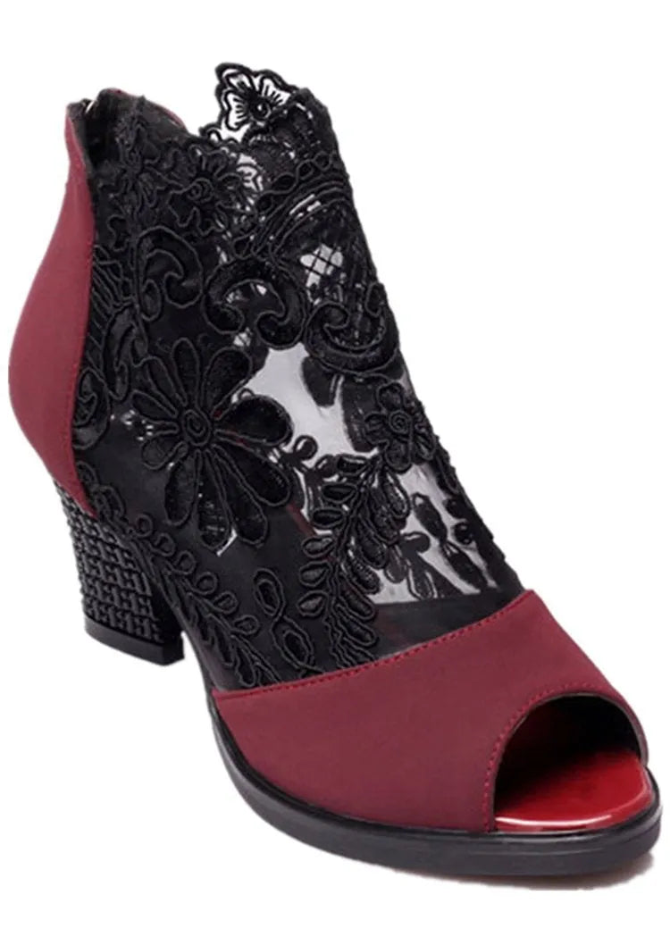 Women's black lace gladiator sandals with square heel, floral pattern, and peep toe design