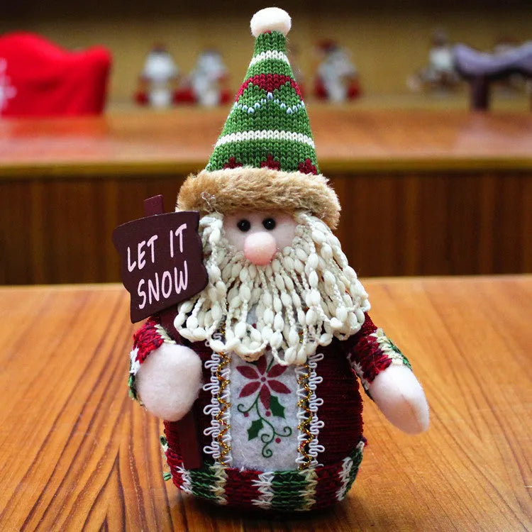 Red, green, and white flannel snowman Christmas wall hanging decoration measuring 18 by 13 centimetres.