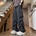 Plus size black waterproof loose straight-leg trousers with drawstring waist on hanger