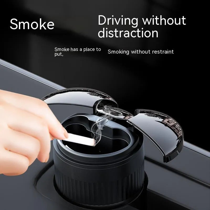Black smart infrared metal car ashtray with lid on a car dashboard.