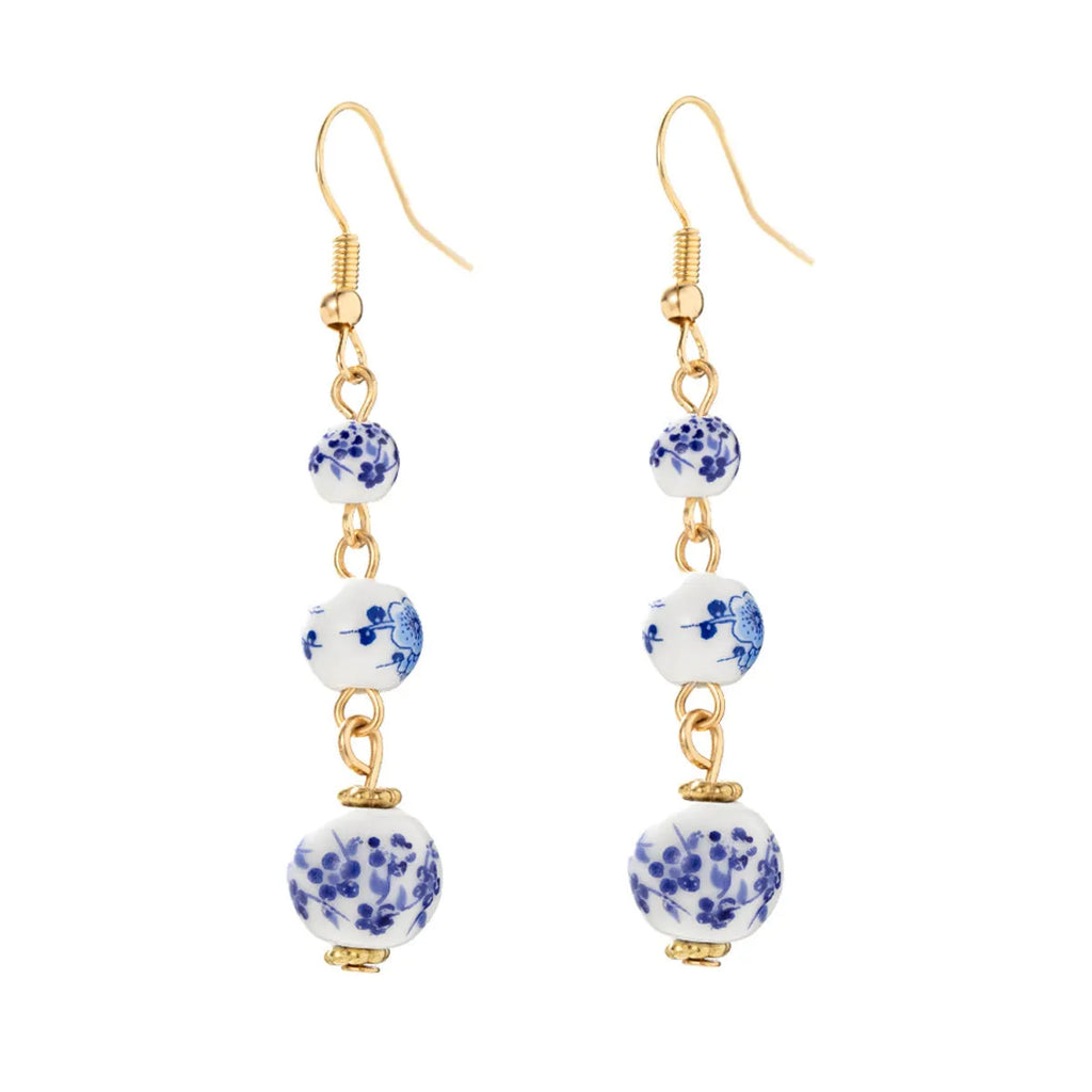 Blue and white porcelain ceramic bead long drop earrings with geometric alloy design