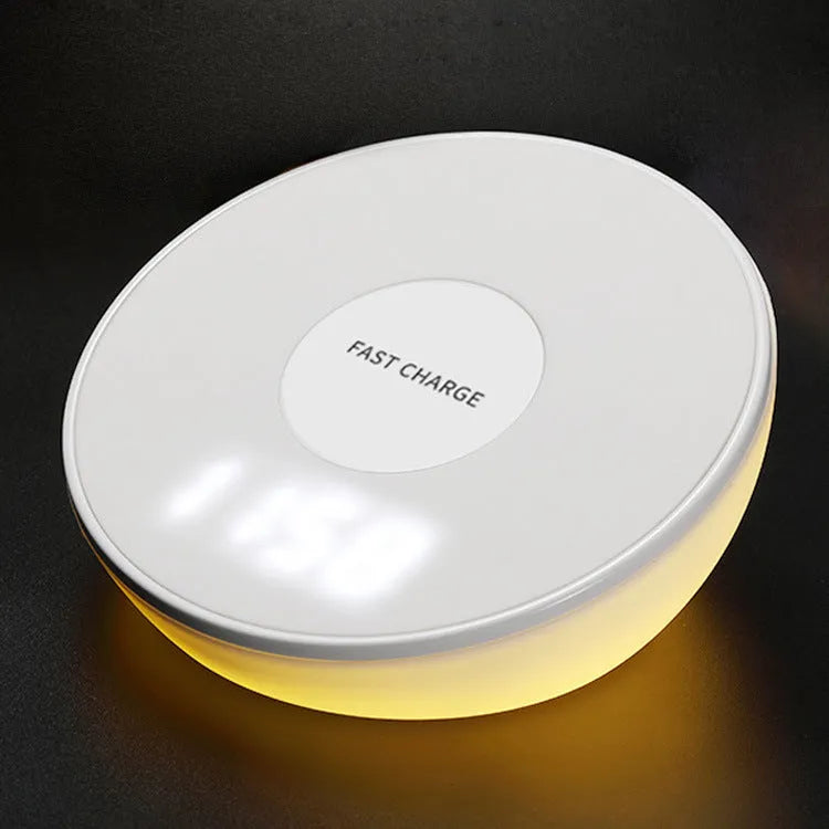 White wireless phone charger with digital clock display and three control buttons on the front.