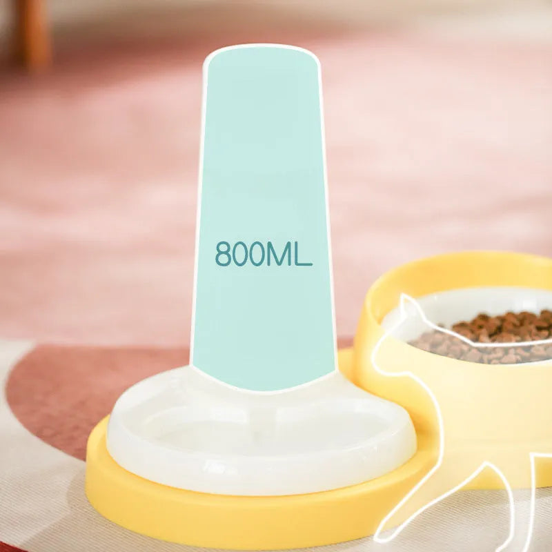 Grey and yellow dual pet feeding bowl with raised neck support and separate food and water compartments.