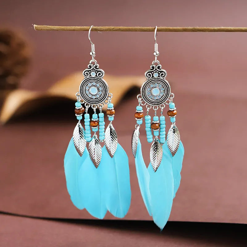 Round drop feather earrings with leaf patterning in alloy, available in multiple electroplated colours.