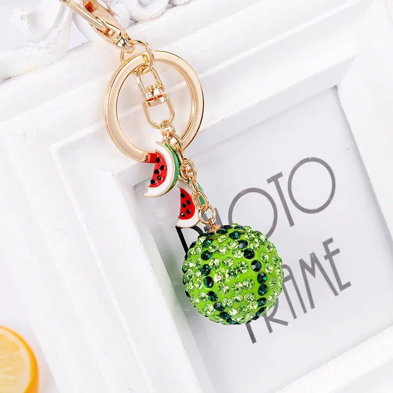 Green watermelon-shaped zinc alloy keychain measuring 12cm with fruit diamond design