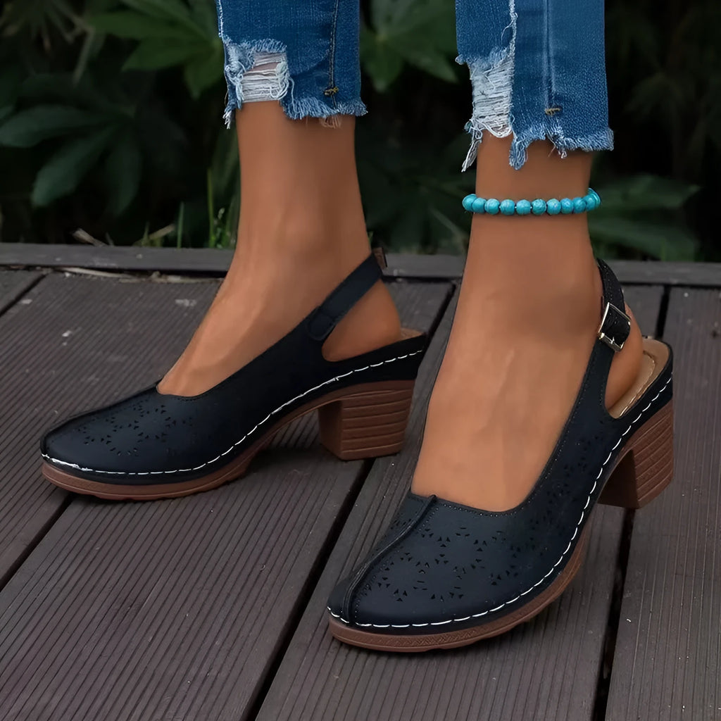 Women's closed toe wedge sandals in wine red colour showing round toe shape and wedge design