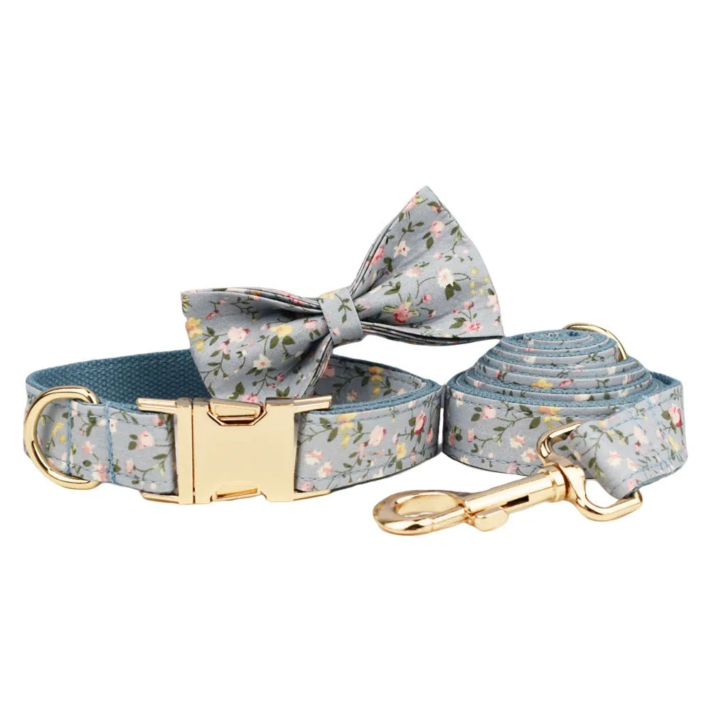 Blue floral polyester cotton dog collar set with matching leash, vest, bow and accessories