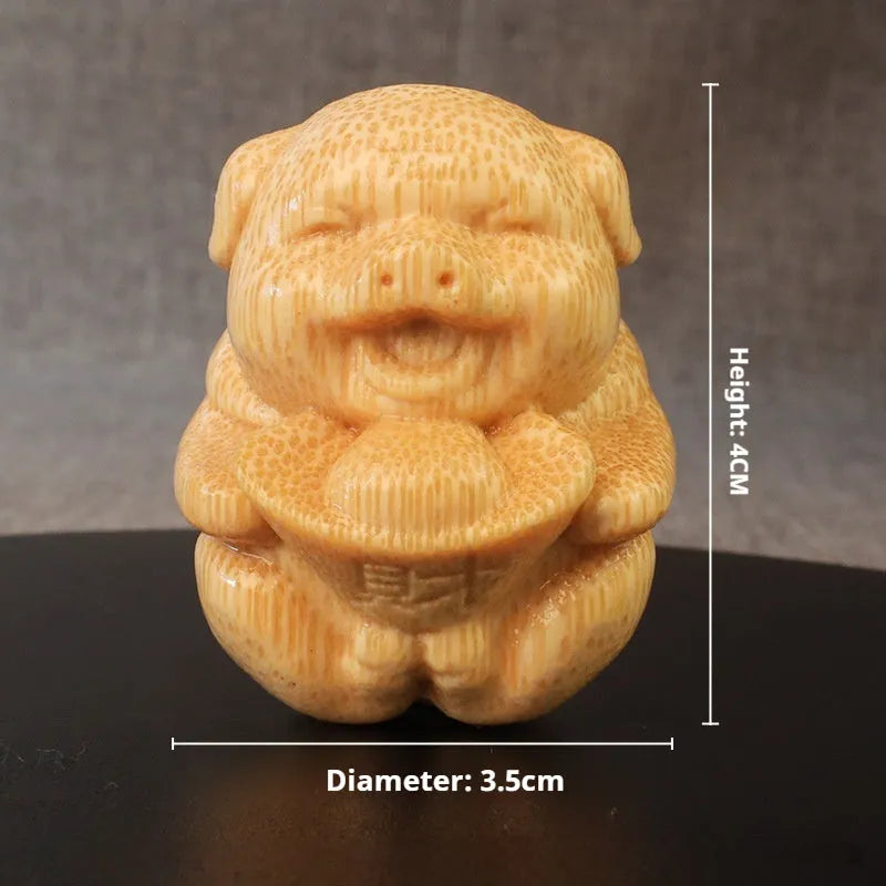 Bamboo pig carving ornament with ingot shape measuring 4cm height and 3.5cm diameter