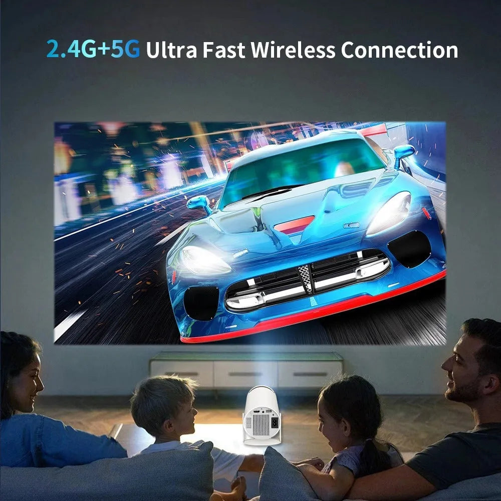 White X10 PLUS portable projection game machine with remote control and gamepad on wooden surface