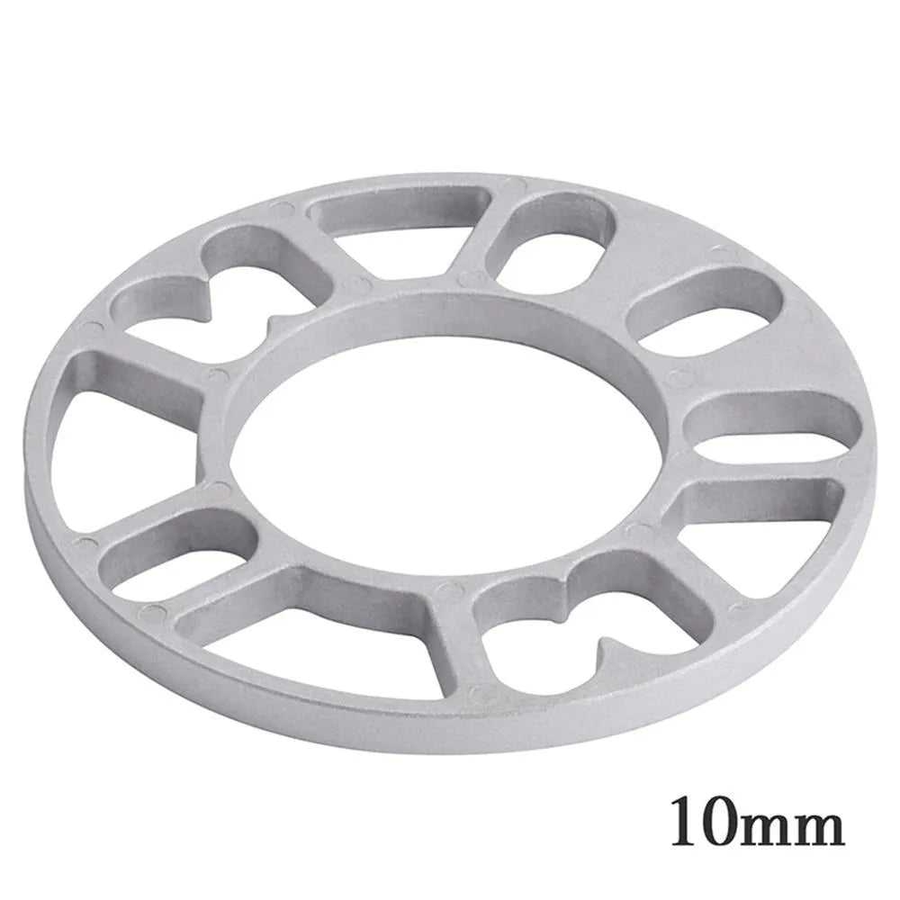 A single, circular metal automotive wheel hub spacer gasket for modifying wheel offset and brake clearance.