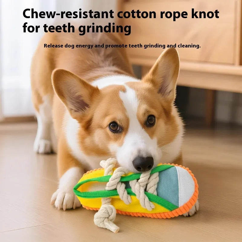 Plastic dog chew toy in yellow, shown bending to produce a sound.