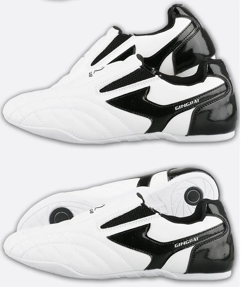 Black and white children's Sanda martial arts training shoes with a soft sole, shown with a shoe bag and socks.