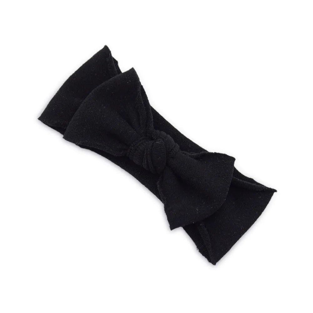 Solid colour knotted cloth headband for baby girls with bowknot design, available in 37 colours