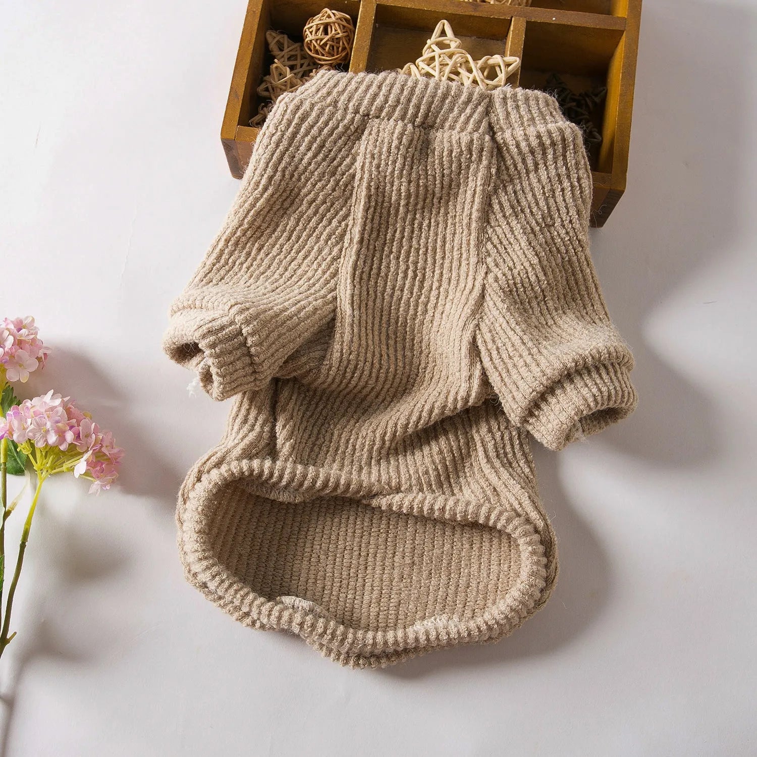 Brown cloth pullover sweater on a small dog, showing casual style and fit for breeds like Bichon or Pomeranian.