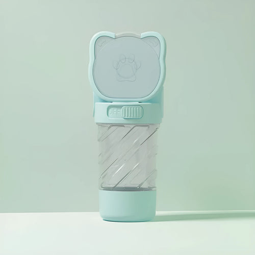 Green 3-in-1 portable pet water bottle with food container and waste bag dispenser on a strap.