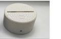 3D rose flower decorative night light with remote control on a bedside table.