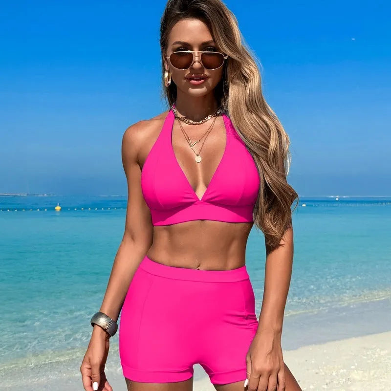 Women's black nylon bikini swimsuit laid flat, showing sleeveless design.