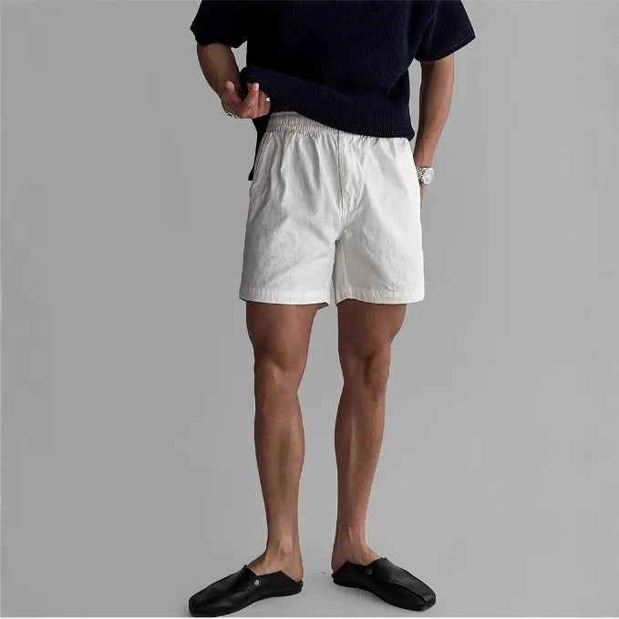 Men's loose fit cotton sports shorts in black, white, or khaki for summer wear