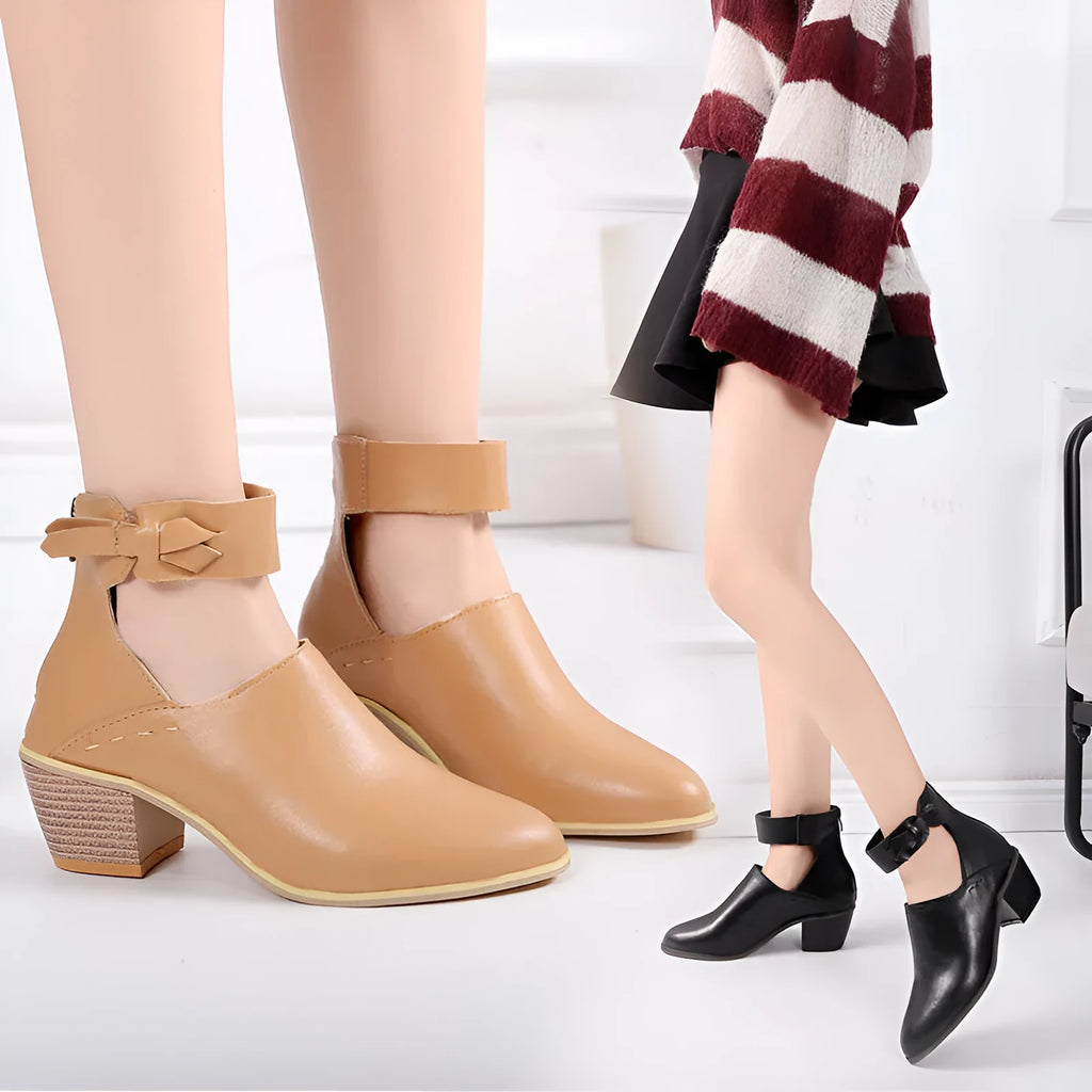 Vintage high heels woman ankle boots with round toe and middle heel in black artificial PU