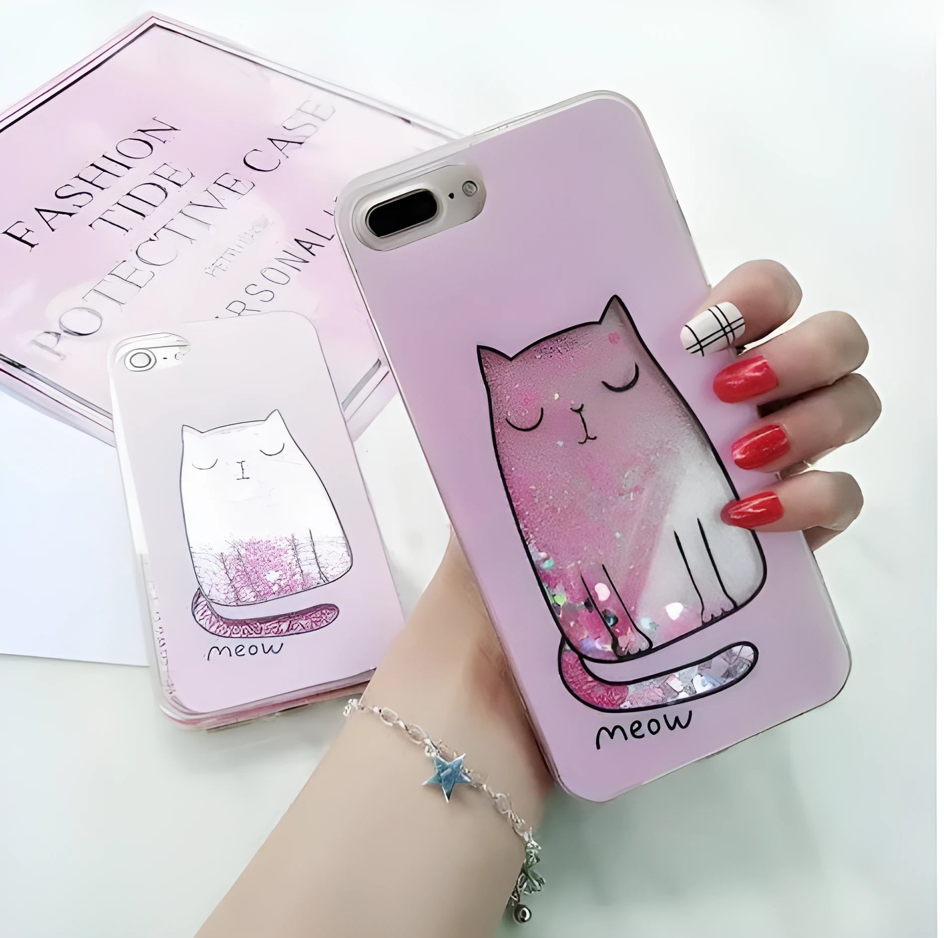 Four glittery cat design phone cases for iPhone models 6 to X on a table.