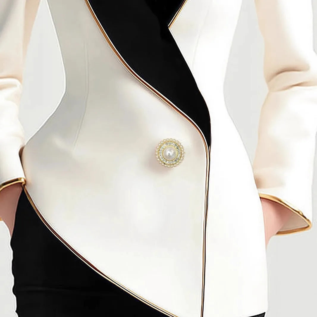 Milky white women's coat with golden edge detailing and pearl button front closure