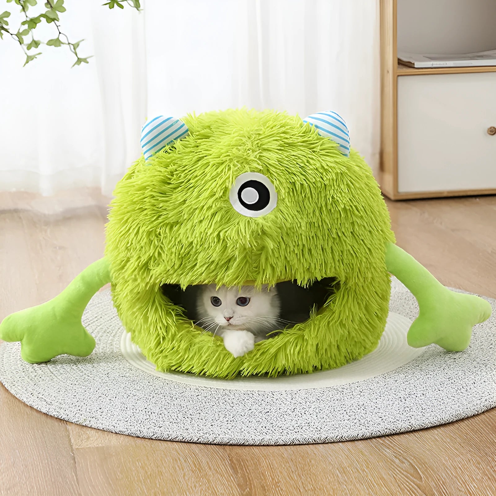 Fluffy round cat bed with non-slip base shown in three size options