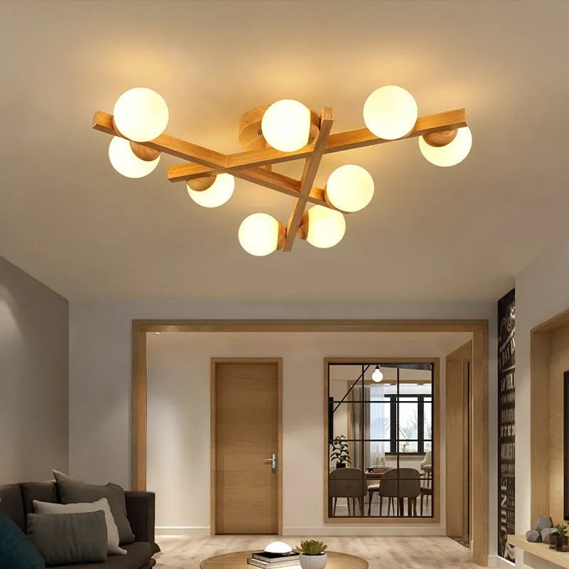 Modern wooden finish ceiling light with three adjustable lamp heads in a neutral white colour.