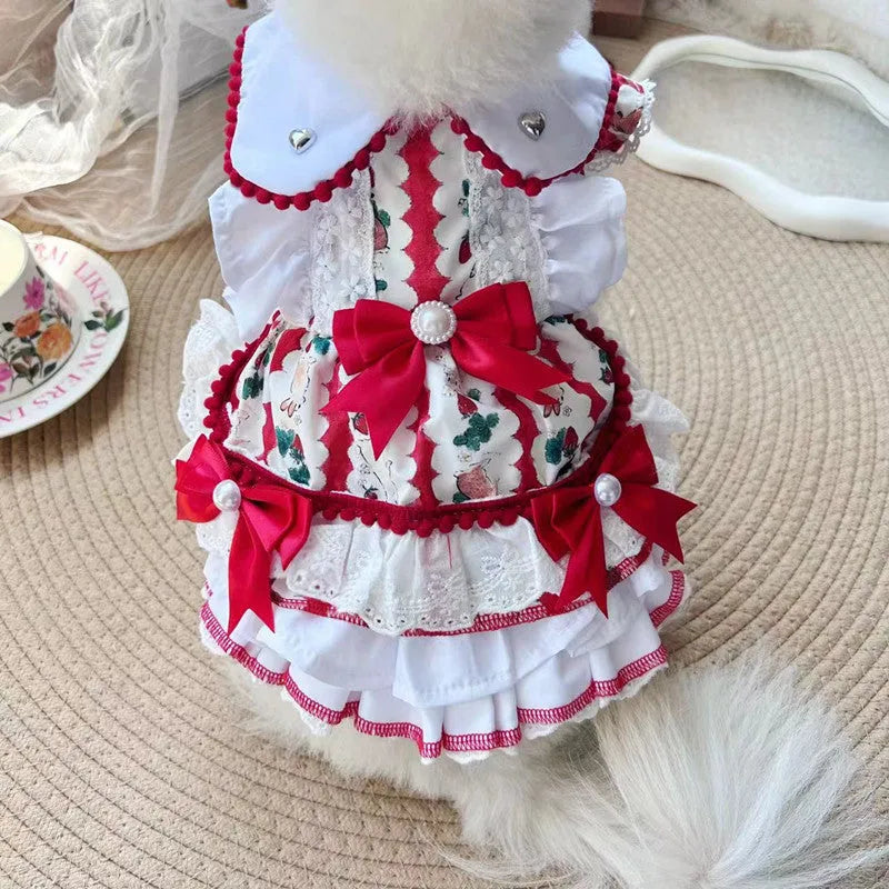 A small dog wearing a lightweight white and grey rabbit-themed princess skirt.