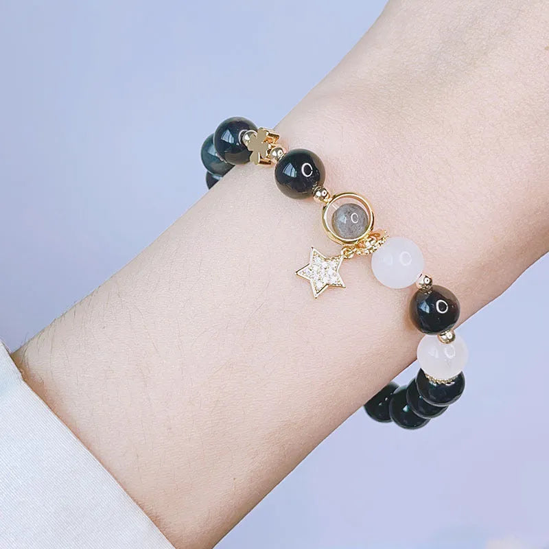 Silver stone bracelet for women with electroplated finish showing flower, love heart and star charm options