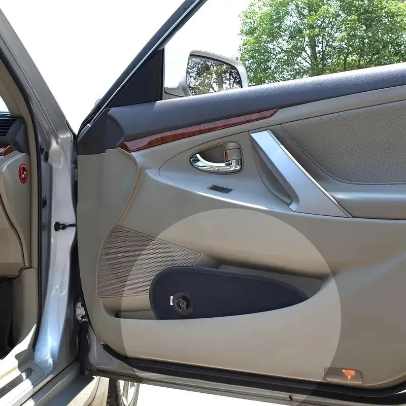 Black breathable mesh car side window shade stretched over glass with visible suction cups.