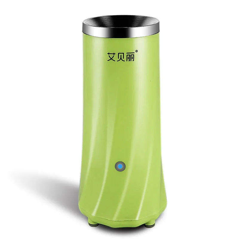 Beige white and green coloured multifunctional mini breakfast machine on a kitchen countertop.