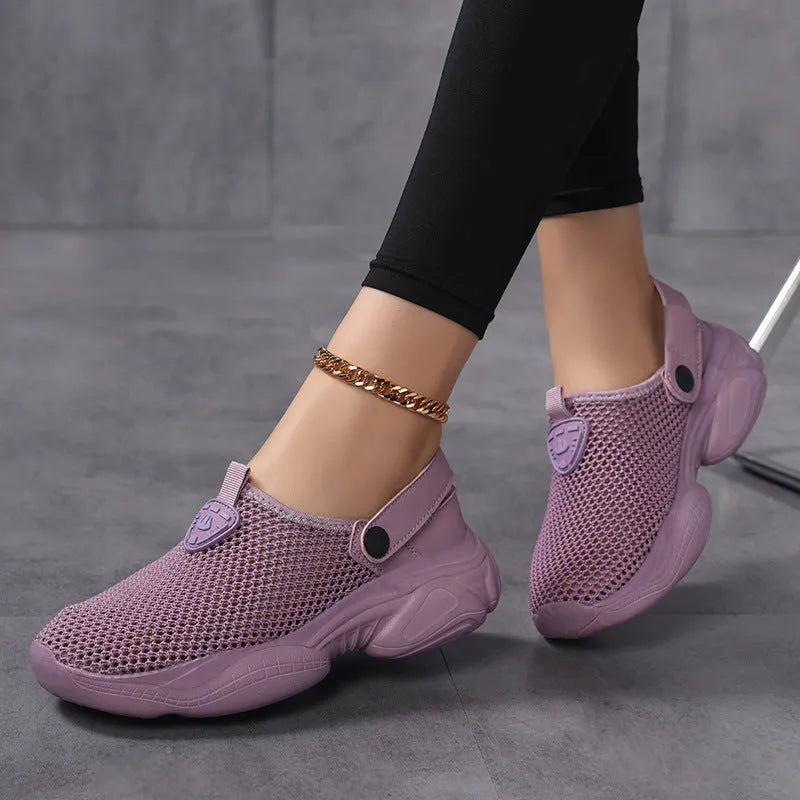Women's beige Flyknit casual sports sandals with round toe holder, shown on a foot.