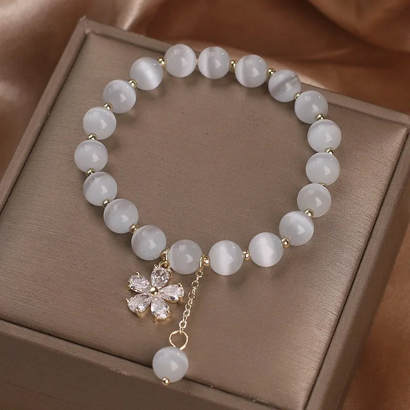 Women's white cat's eye stone bracelet with morganite safety buckle and flower tassel decoration