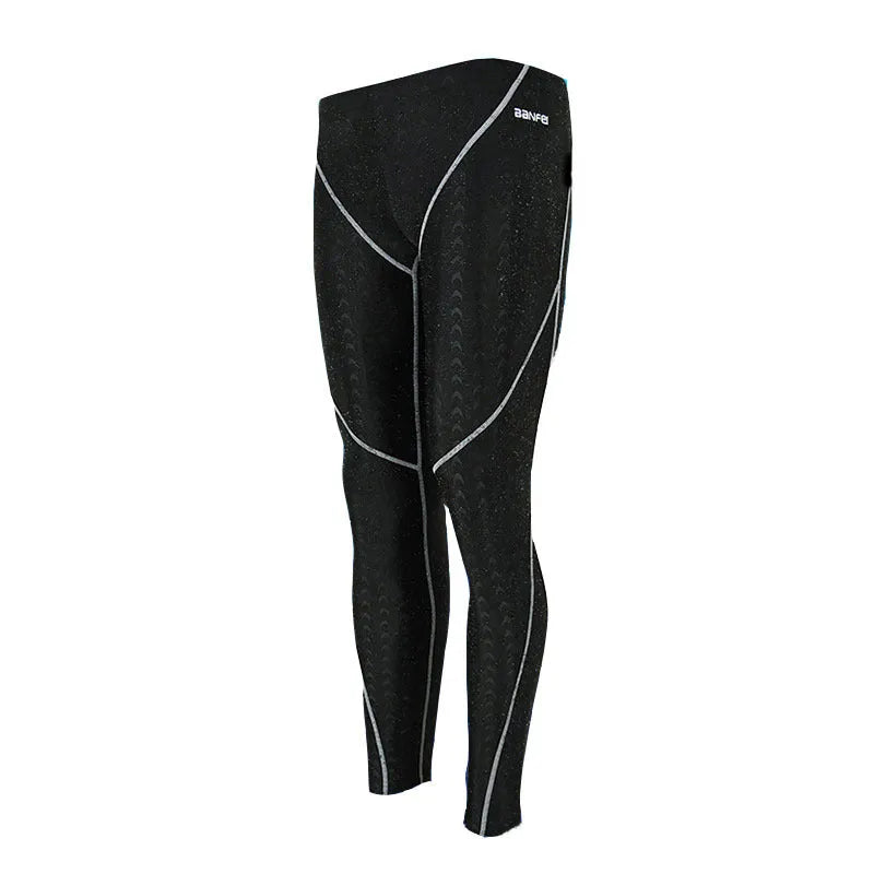 Men's black nylon cropped swimming trunks with green line detail for swimming and sports