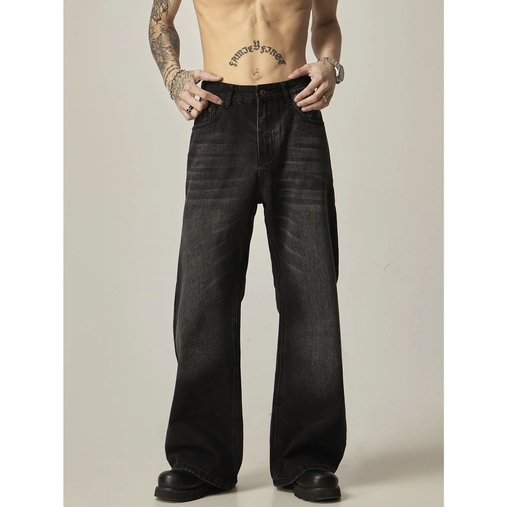 Black loose straight-leg retro jeans on a mannequin, showing zipper fly and relaxed fit.