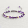 Women's freshwater pearl and geometric crystal bracelet on a stretchy elastic rope.