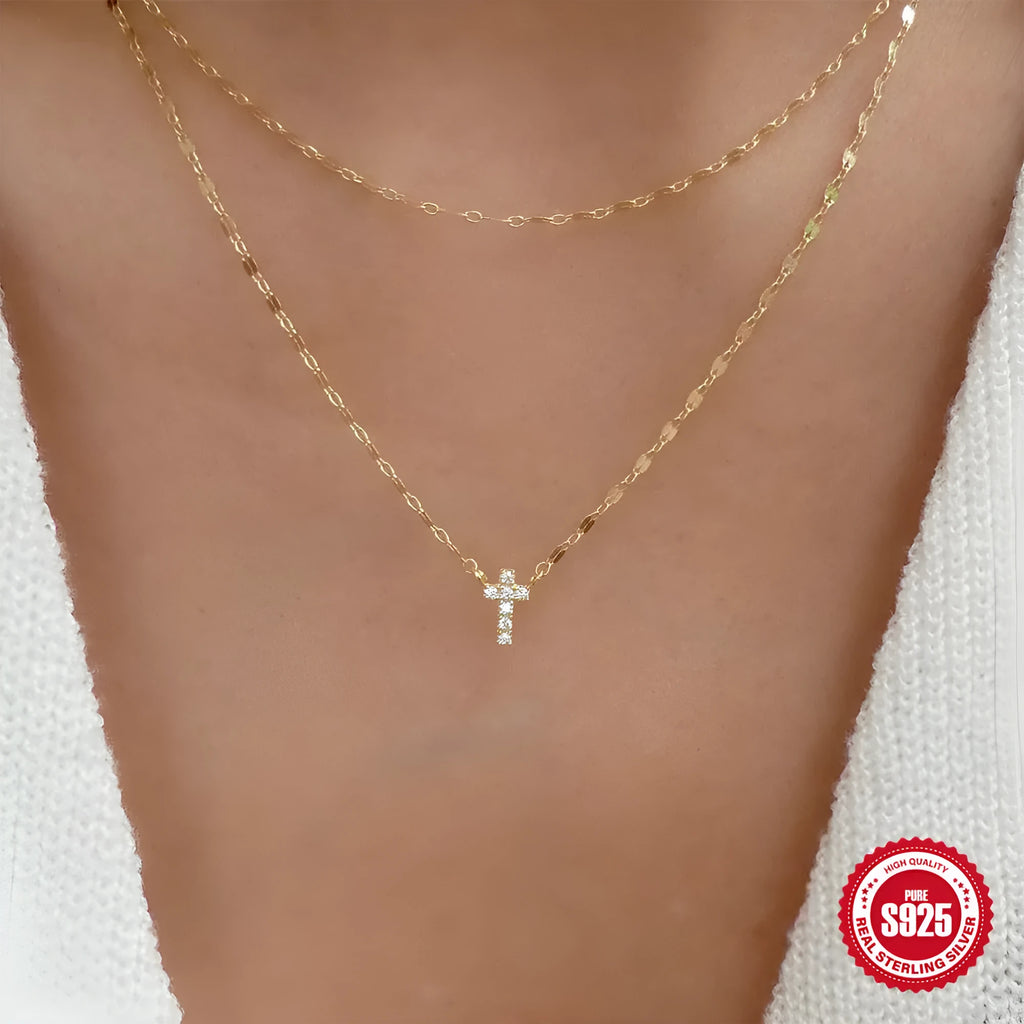 S925 sterling silver double layer cross pendant necklace with twin diamond details on a clavicle chain.
