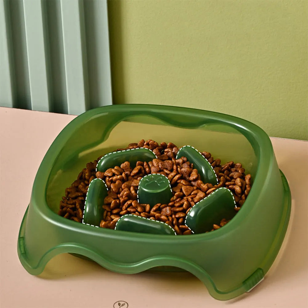 Blue plastic slow feeder dog bowl with anti-choking design on a white background