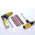 Vacuum tyre repair tool set with probe, pin, glue, and rubber strips for motorcycle and car puncture repair.