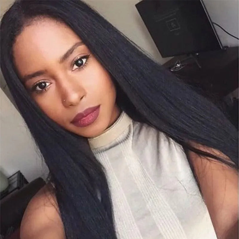 Long straight black synthetic wig with centre part and bangs on a model